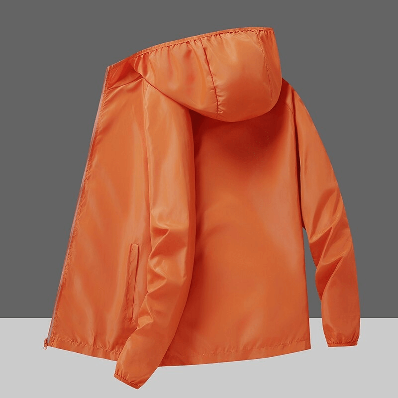 Orange waterproof reflective sun protective women's jacket for camping and hiking.